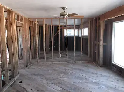 Room stripped to the studs with the flooring removed after a water loss